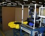 This machine was designed to feed shim stock, punch a hole, feed and set an eyelet, cut parts to length, and sort different parts into bins. images/sm/watlo012.jpg